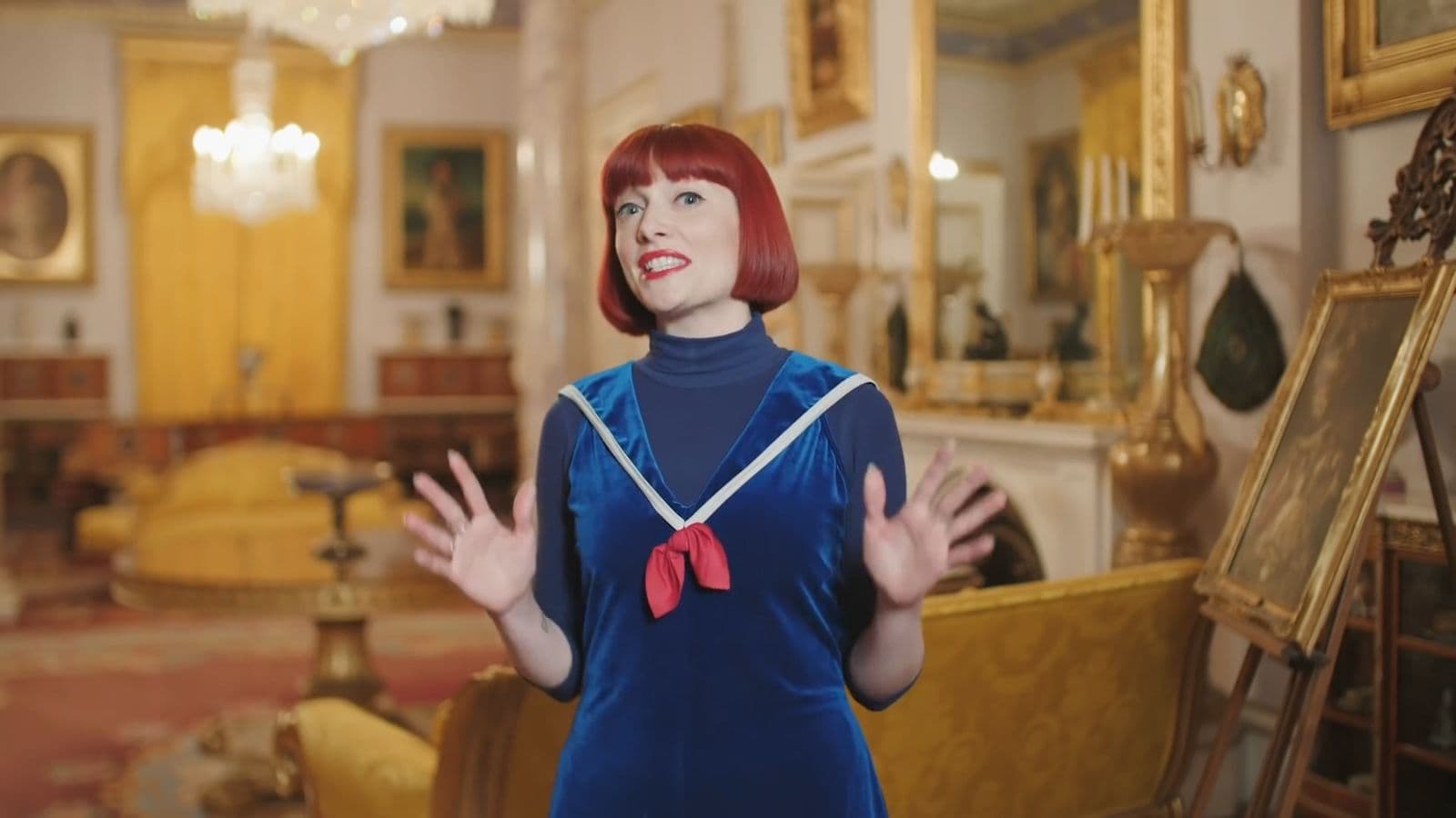 A performer mid-take in a gilded gallery
